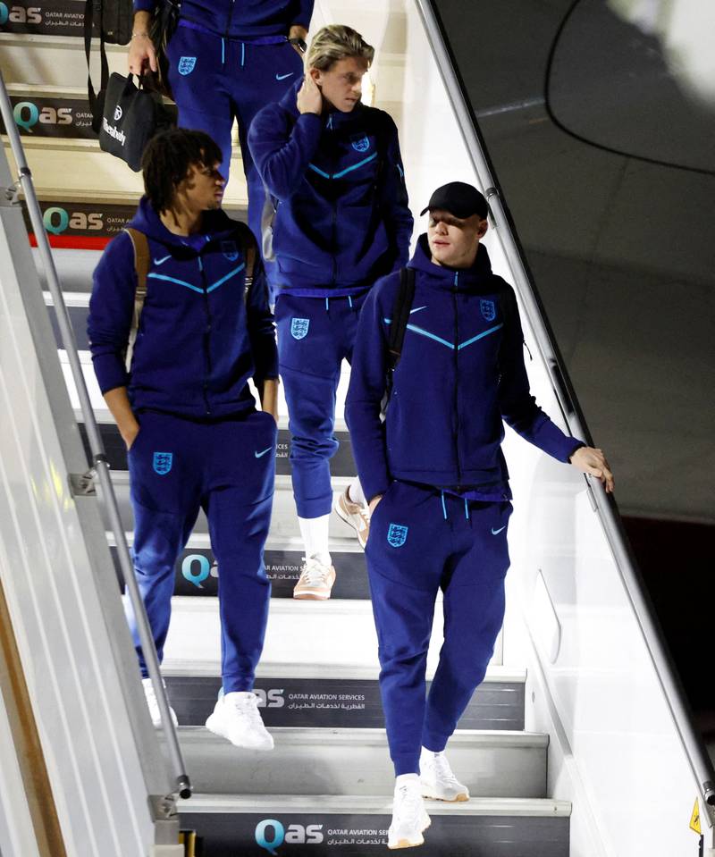 England's Aaron Ramsdale, Trent Alexander-Arnold and Conor Gallagher arrive in Doha. Reuters