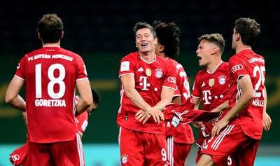 Robert Lewandowski and teammates celebrate winning the German Cup. Reuters