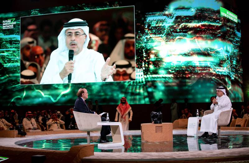 Amin Nasser, chief executive of Saudi Aramco, right, during a panel session. Bloomberg