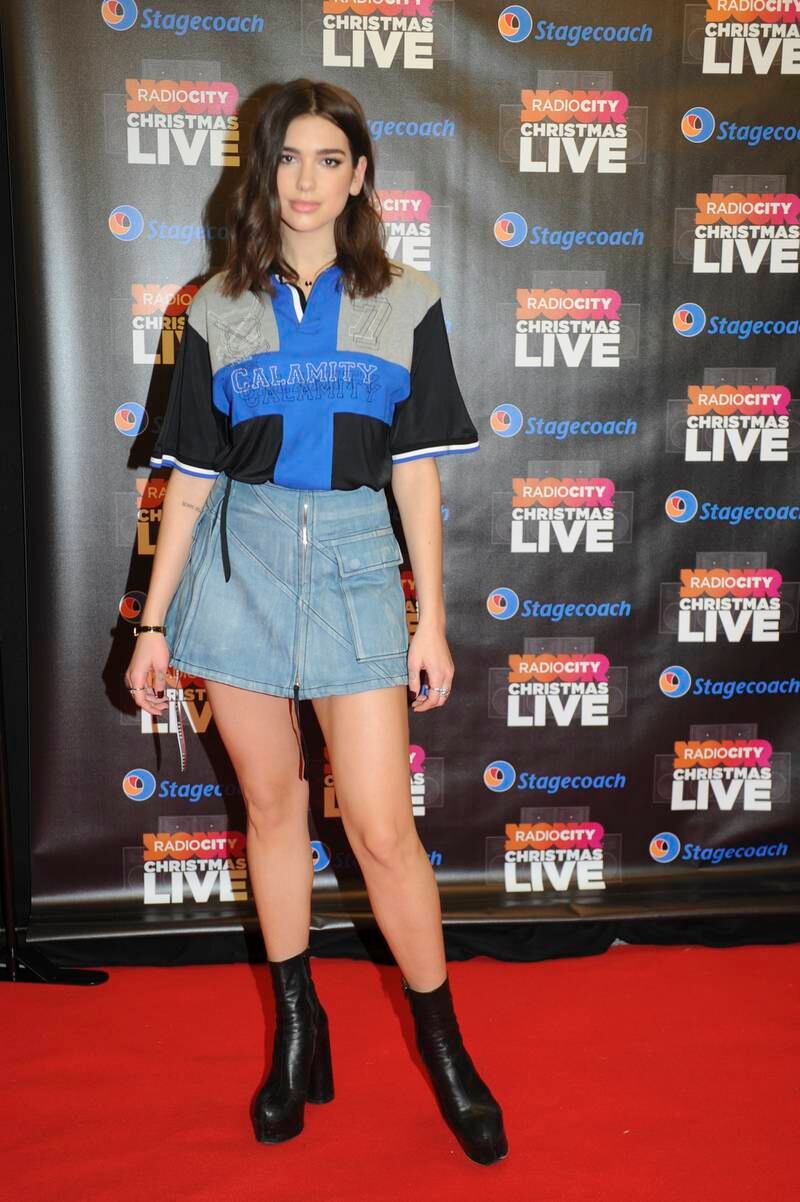 Dua Lipa, in a denim skirt and jersey, attends Radio City Christmas Live at Echo Arena on December 17, 2016 in Liverpool, England. Getty