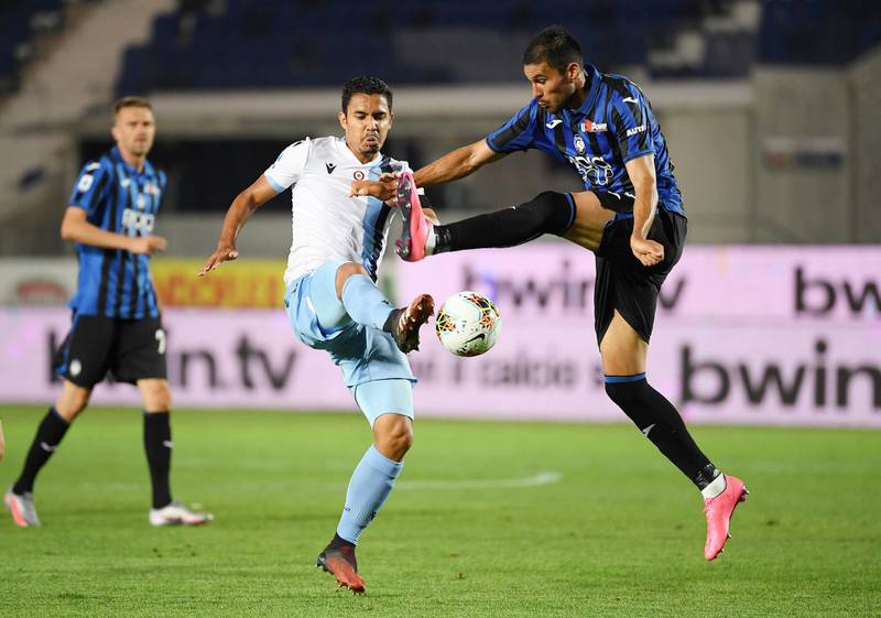 Lazio's Andre Anderson in action with Atalanta's Jose Luis Palomino. Reuters