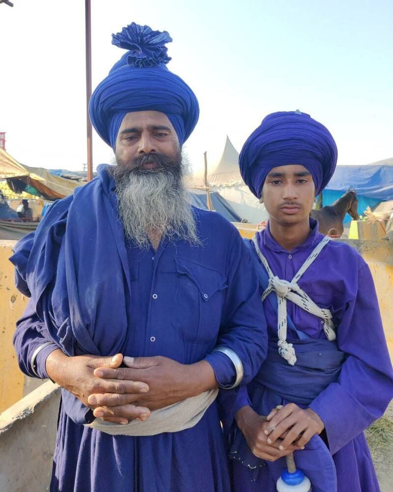 Talwinder Singh, 50, looks after Sartaj Singh, 15, and four other young boys as they train to become Nihang warriors, a 17th century order founded by last Sikh Guru Gobind Singh. Taniya Dutta for The National