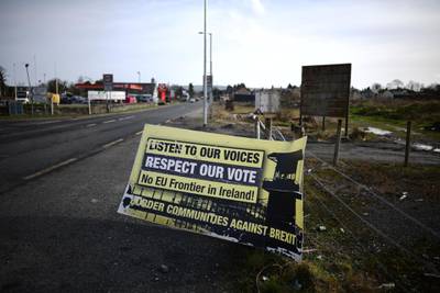 BELLEEK, NORTHERN IRELAND - FEBRUARY 14: A Border Communities Against Brexit sign can be seen on the Irish border on February 14, 2019 in Belleek, Northern Ireland. Britain will leave the European Union on March 29 following the referendum in 2016. Many people in Northern Ireland and Ireland are concerned about a return of a so-called hard border, which could inspire unrest reminiscent of the Troubles. (Photo by Charles McQuillan/Getty Images)