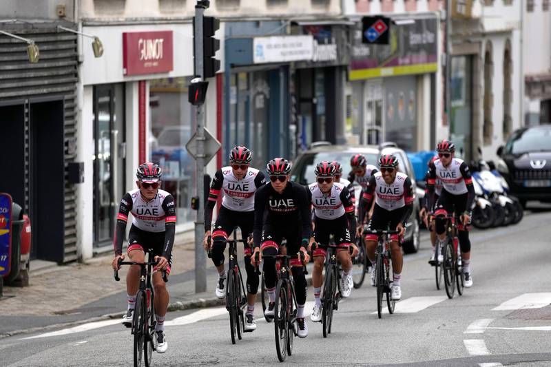 Tadej Pogacar center, rides during a training with teammates in Brest. AP