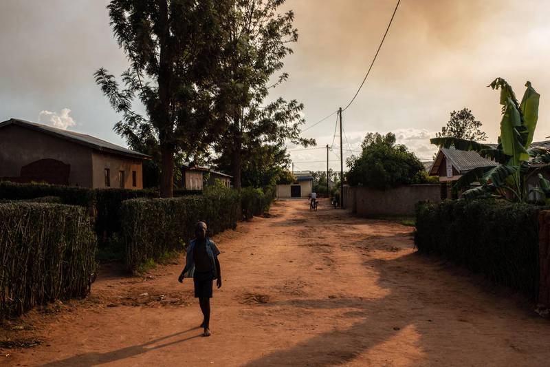 RWERU, RWANDA - APRIL 06: A boy walks down a street of a reconciliation village on April 06, 2019 in Rweru, Rwanda. The villages are home to both ex-perpetrators and victims of the genocide in 1994 that live peacefully together. (Photo by Andrew Renneisen/Getty Images)