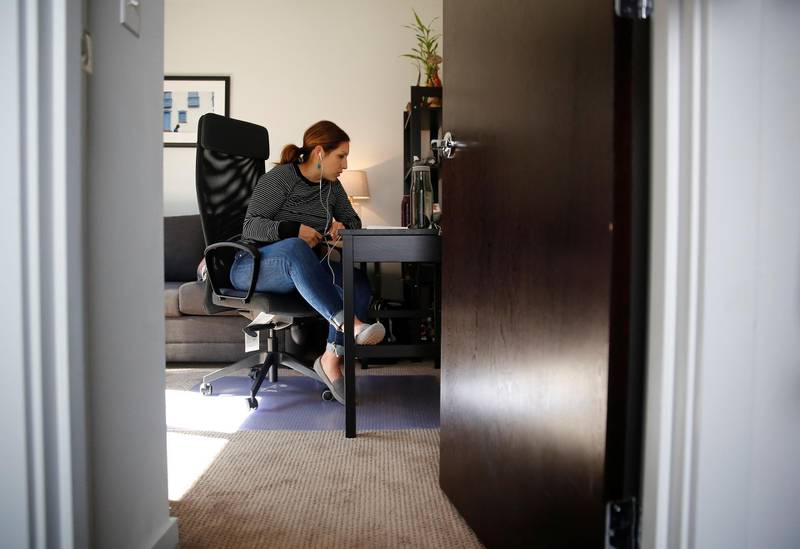 Seattle City Councilmember Teresa Mosqueda attends a council meeting by phone in her office due to the council's temporary work from home policy during the coronavirus disease (COVID-19) outbreak in Seattle, Washington, U.S. March 23, 2020. REUTERS/Lindsey Wasson