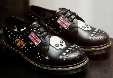 A pair of Dr Martens shoes adorned with the Union Jack is displayed at a shop in Singapore. REUTERS/Edgar Su/File Photo