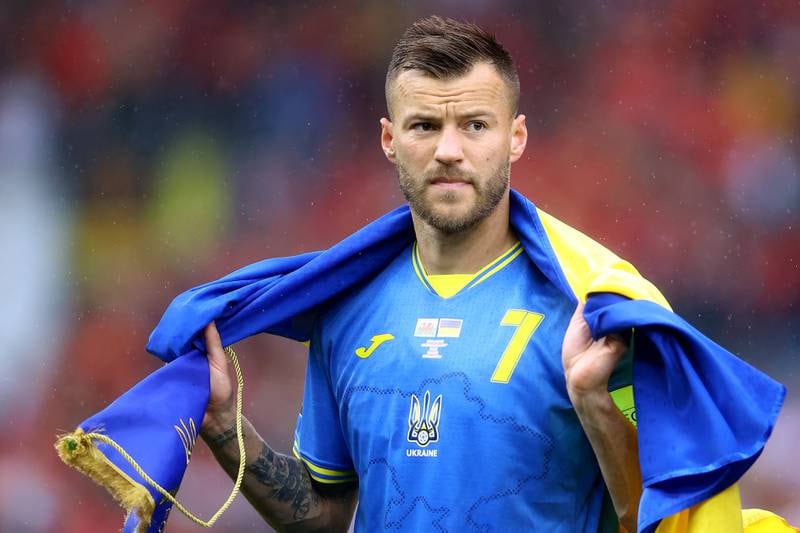 Andriy Yarmolenko of Ukraine lines up on the pitch with their countries flag prior to the match against Wales. Getty Images