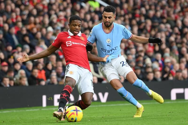 Tyrell Malacia of Manchester United is challenged by City's Riyad Mahrez. Getty