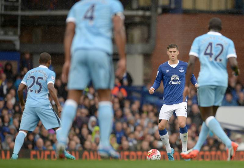Everton's John Stones looks to play the ball against Manchester City on Sunday during their Premier League contest at Goodison Park. Oli Scarff / AFP