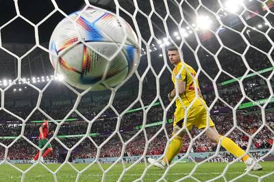 Spain's goalkeeper Unai Simon watches Morocco's Achraf Hakimi's winning penalty hits the back of the net. AP 