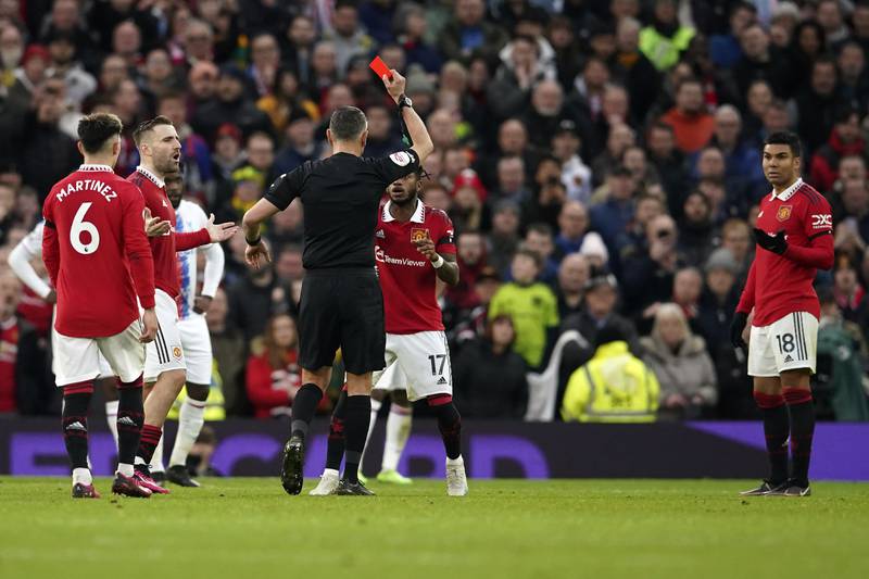 Referee Andre Marriner shows a red card to Manchester United's Casemiro. AP