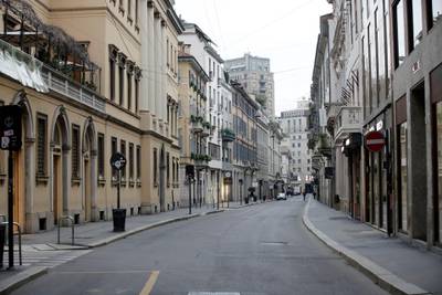 A view of a deserted street in downtown Milan. AP Photo