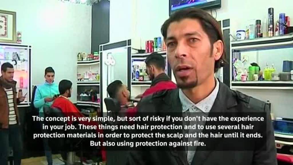 Gazan barber offers flaming hot new style - video