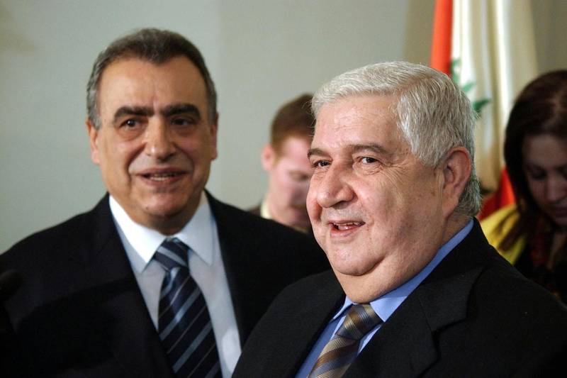Syrian vice Foriegn Minister Walid al-Mouallem (R) and Lebanese Foreign Minister Mahmud Hammud pose for a picture 01 February 2005 following their meeting in the Lebanese capital Beirut. Syrian Prime Minister Naji Otri is on a state visit to Lebanon too.     AFP PHOTO/JOSEPH BARRAK (Photo by JOSEPH BARRAK / AFP)
