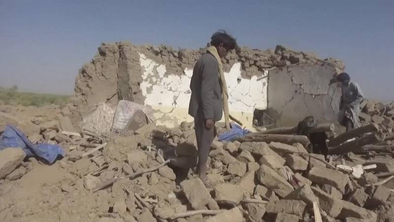 People rummage through rubble after an air strike in Yemen's Jawf province Yemen in this still image taken from a video. Houthi Media Centre via Reuters