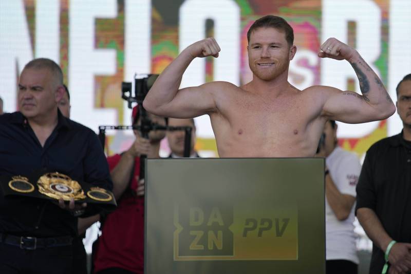 Saul Alvarez poses during the weigh-in for his fight against Dmitry Bivol. AP