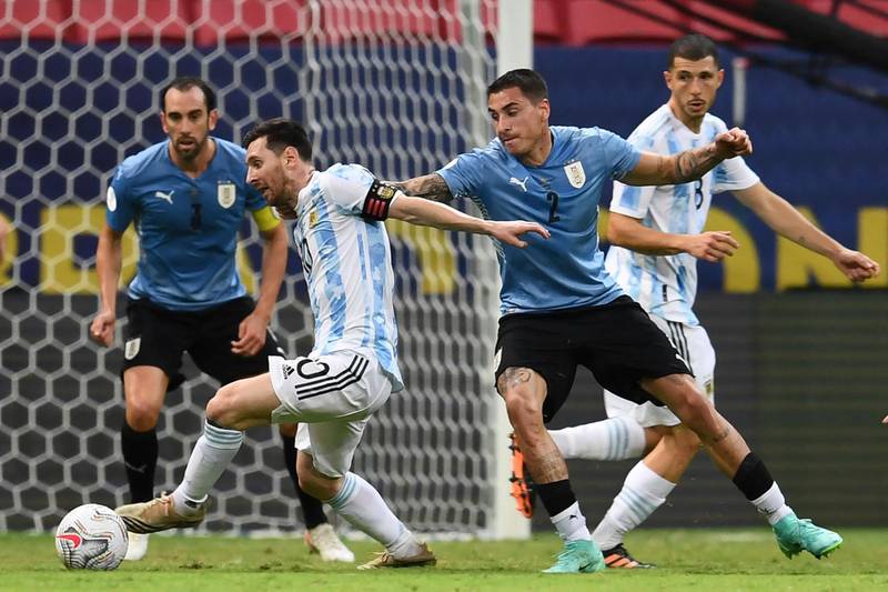 Messi and Uruguay's Jose Maria Gimenez battle for the ball. AFP