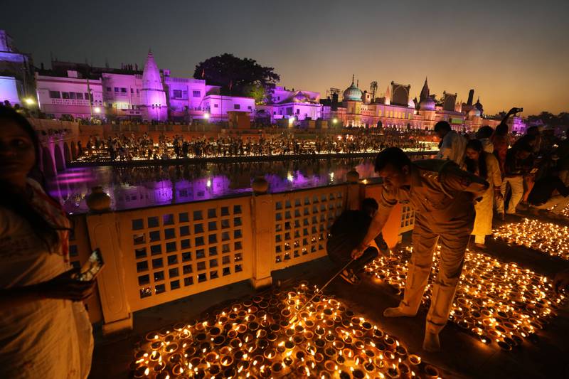 People light lamps on the banks of the river Saryu in Ayodhya, India. AP