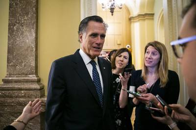 Senator Mitt Romney, a Republican from Utah, speaks to members of the media following a vote on the national emergency declaration in Washington, D.C., U.S., on Thursday, March 14, 2019. The Senate voted to block President Donald Trump's declaration of a national emergency to pay for a wall at the border with Mexico, setting up his first veto and highlighting a growing willingness by Republicans in the chamber to split with their president. Photographer: Al Drago/Bloomberg