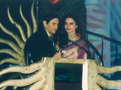 The awards returned to South Africa in 2003, this time to Johannesburg, hosted by Anil Kapoor and Dia Mirza. Pictured: veteran actor Dev Anand, who died in 2011, was given a career achievement award by Rekha. 