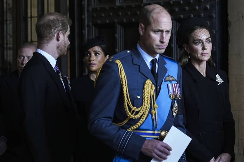Prince William, Kate, Princess of Wales, Prince Harry and Meghan, Duchess of Sussex, after paying their respects to Queen Elizabeth II, at the lying-in state at Westminster Hall, central London. AP 