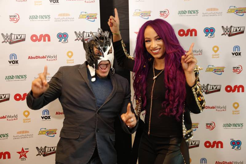 Sasha Banks, right, with Kalisto, made history with Alexa Bliss in the UAE by competing in the WWE's first women's match in the UAE. Image courtesy of the WWE.