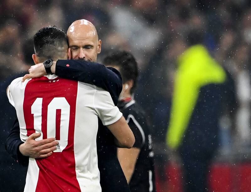 Ajax manager Erik ten Hag celebrates with Dusan Tadic. EPA