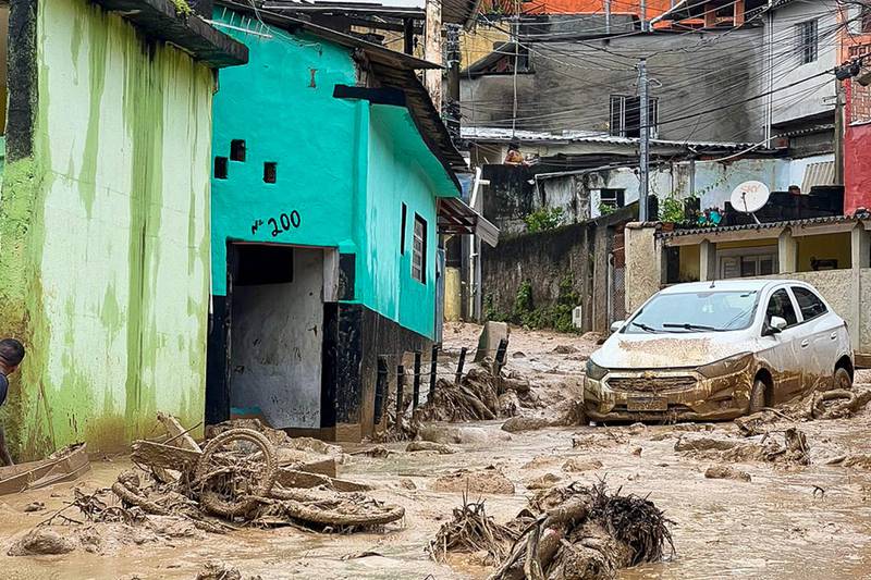 This handout picture released by Sao Sebastiao City Hall shows the damage caused by heavy rains in the municipality of Sao Sebastiao, north coast of the state of Sao Paulo, Brazil, on February 19, 2023.  - A strong storm with a "record" amount of rain caused at least 19 deaths from floods and landslides during the carnival weekend in several towns in the state of Sao Paulo, authorities reported on Sunday.  (Photo by NELSON ALMEIDA  /  Sao Sebastiao City Hall  /  AFP)  /  RESTRICTED TO EDITORIAL USE - MANDATORY CREDIT "AFP PHOTO  /  SAO SEBASTIAO CITY HALL  /  DANIELA ANDRADE" - NO MARKETING NO ADVERTISING CAMPAIGNS - DISTRIBUTED AS A SERVICE TO CLIENTS