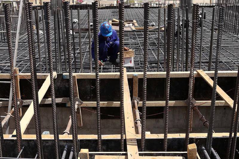 Inspectors from Abu Dhabi Municipality found men working at height on unfinished floors and temporary platforms without safety equipment to prevent them from falling. Pawan Singh / The National
