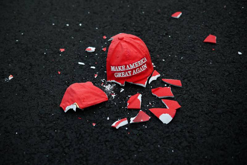 A broken Make America Great Again hat model lies on the ground as people gather at Black Lives Matter Plaza in Washington. Reuters