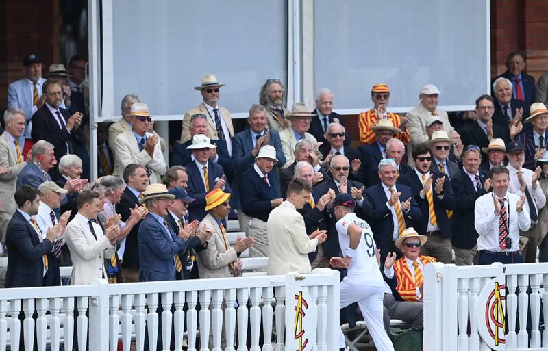 England bowler James Anderson is applauded off the field by the MCC Members in the famous Lord's pavilion. Getty