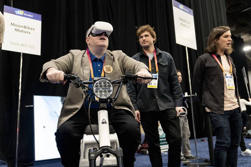 A man tries out a snow bike made by Moonbike Motors. Bloomberg