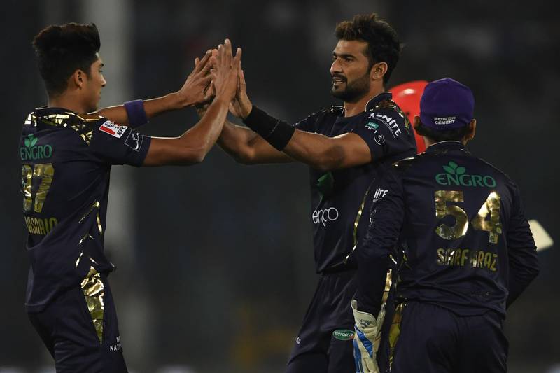 Quetta Gladiators' Sohail Khan celebrates with team mate Mohammad Hasnain after the dismissal of Islamabad United's Amad Butt.  AFP