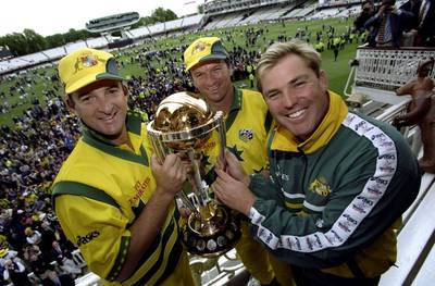 Mark Waugh, left, Steve Waugh and Shane Warne, right, of Australia with the trophy after victory over Pakistan in the 1999 World Cup final at Lord's. Clive Mason /Allsport