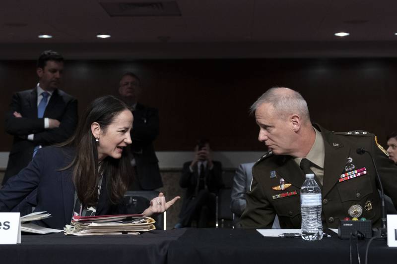 Director of National Intelligence Avril Haines speaks with DIA Director Lt Gen Scott Berrier during a Senate Armed Services hearing to examine worldwide threats. AP