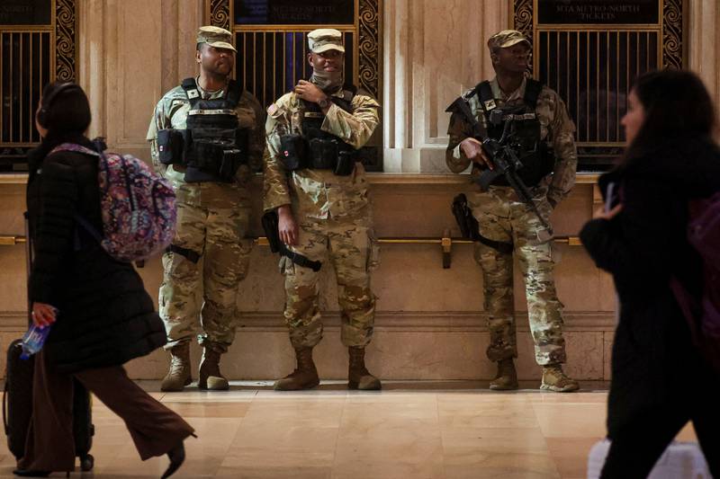 Members of the US Army National Guard remain vigilant as travellers pass through Grand Central Terminal in New York. Reuters