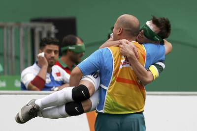Ricardinho of Brazil celebrates with team member after scoring in men’s five-a-side football. Ricardo Moraes / Reuters