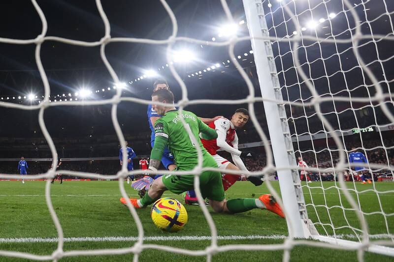 Gabriel Martinelli of Arsenal scores the team's fourth goal past Jordan Pickford of Everton. Getty Images