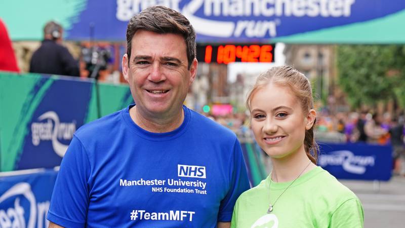 Mayor of Greater Manchester Andy Burnham and Freya Lewis, 19, who learnt to walk again after suffering fractures and burns in the bombing. PA