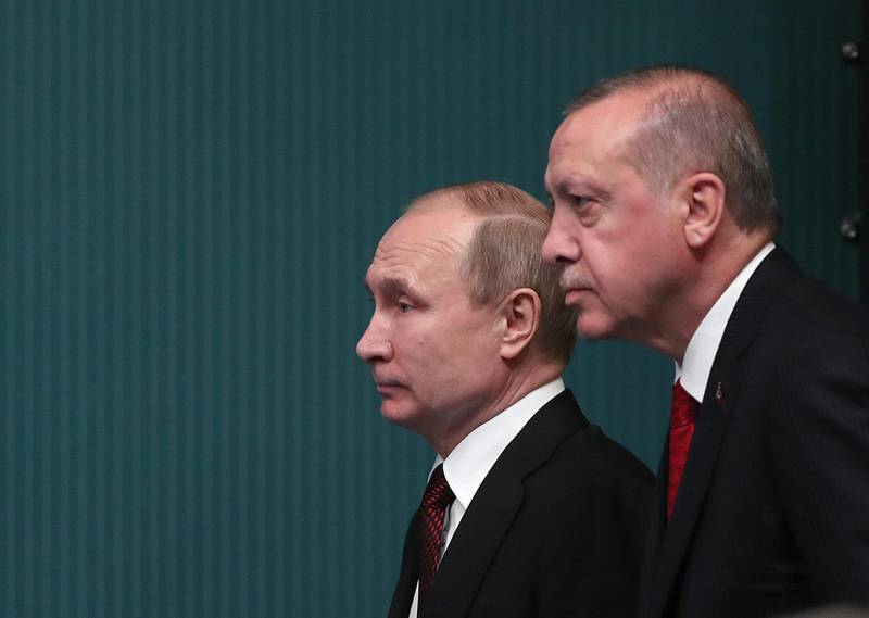epa06643700 Turkish President Recep Tayyip Erdogan (R) and Russian President Vladimir Putin (L) attend a press conference after their meeting at the Presidential Palace in Ankara, Turkey, 03 April 2018. Putin is in Ankara on a two-day official visit at the invitation of Turkish President Recep Tayyip Erdogan. The agenda includes Putin's participation in a trilateral meeting on 04 April, with Erdogan and Iranian President Hassan Rouhani to discuss settlement in Syria.  EPA/TOLGA BOZOGLU