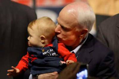 Republican presidential candidate Sen. John McCain, R-Ariz., kisses 9-month old Abri Thompson during a rally, Saturday, Oct. 11, 2008, in Davenport, Iowa. (AP Photo/Charlie Neibergall)   *** Local Caption ***  IACN107_McCain_2008.jpg