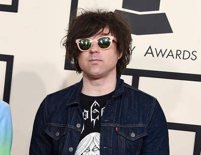 FILE - In this Feb. 8, 2015 file photo, Ryan Adams arrives at the 57th annual Grammy Awards in Los Angeles. A New York Times report says seven women have claimed singer-songwriter Ryan Adams offered to help them with their music careers but then turned things sexual, and he sometimes became emotional and verbally abusive. In the story published Wednesday, Feb. 13, 2019, a 20-year-old female musician said Adams, 44, had inappropriate conversations with her while she was 15 and 16. (Photo by Jordan Strauss/Invision/AP, FIle)