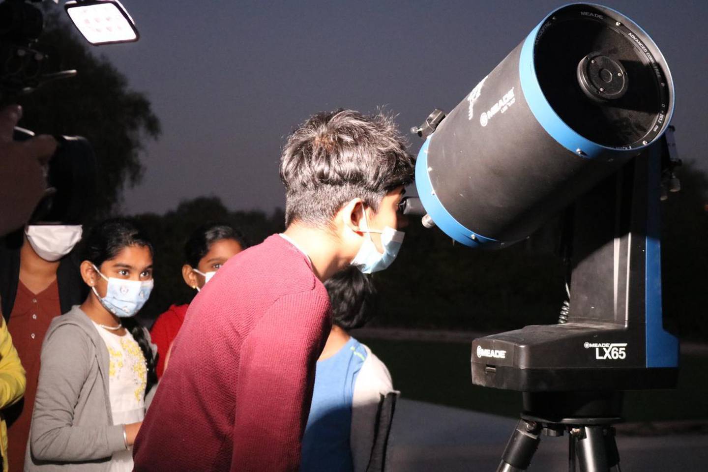 A Dubai resident watches the celestial event through a telescope at Al Thuraya Astronomy Centre. Courtesy: Uzair Tahir