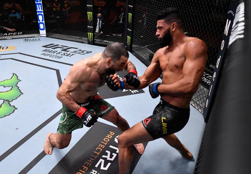 LAS VEGAS, NEVADA - FEBRUARY 13: (R-L) Dhiego Lima of Brazil punches Belal Muhammad in their welterweight fight during the UFC 258 event at UFC APEX on February 13, 2021 in Las Vegas, Nevada. (Photo by Jeff Bottari/Zuffa LLC) *** Local Caption *** LAS VEGAS, NEVADA - FEBRUARY 13: (R-L) Dhiego Lima of Brazil punches Belal Muhammad in their welterweight fight during the UFC 258 event at UFC APEX on February 13, 2021 in Las Vegas, Nevada. (Photo by Jeff Bottari/Zuffa LLC)