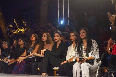 Bollywood Actresses Jacqueline Fernandez, third from left, Deepika Padukone, fifth from left, Vogue India Fashion director Anahita Shroff Adajania, right, enjoy the Manish Malhotra Fashion Show on day two of Lakme Fashion Week.