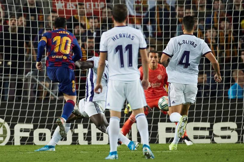 Leo Messi shoots to score the fourth goal during a Spanish La Liga match between Barcelona and Real Valladolid. EPA/ALEJANDRO GARCIA