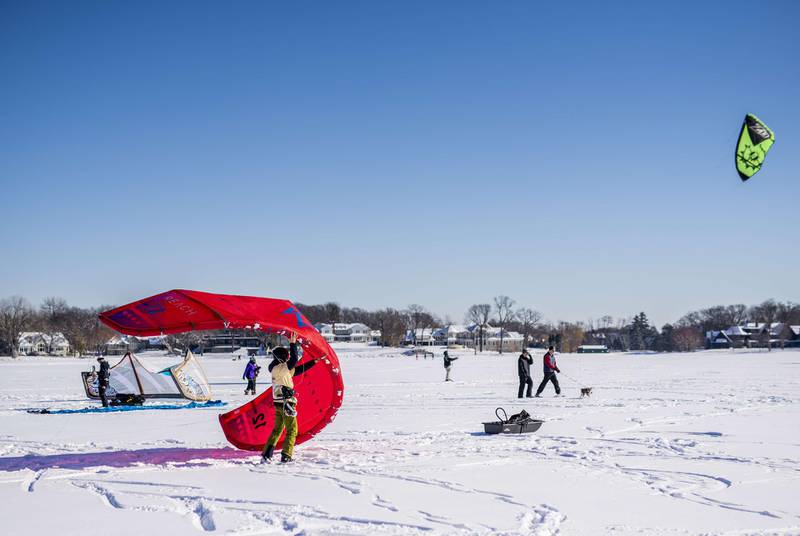 Snowkiting is a growing sport, as people seek new outdoor activities in the winter.   Stephen Maturen/Getty Images/AFP