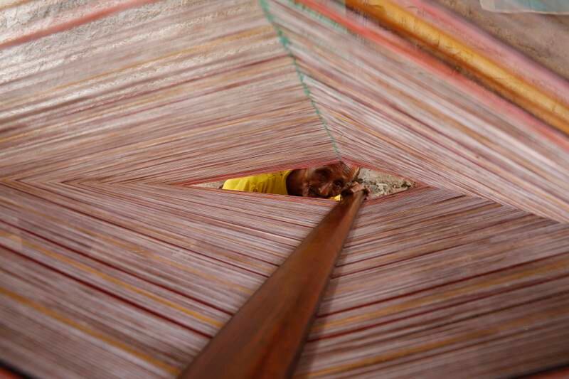 A Yemeni craftsman weaves a traditional men's fabric known as maawaz at a workshop in the port city of Hodeidah in Yemen. Maawaz weaving is a traditional Yemeni craft which is still used to produce traditional clothing for men in the Arab country.  EPA