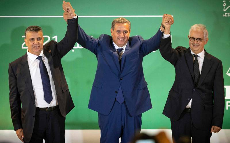 Morocco's prime minister-designate Aziz Akhannouch, Abdellatif Ouahbi and Nizar Baraka after Mr Akhannouch announced a coalition of RNI, PAM and Istiqlal. AFP